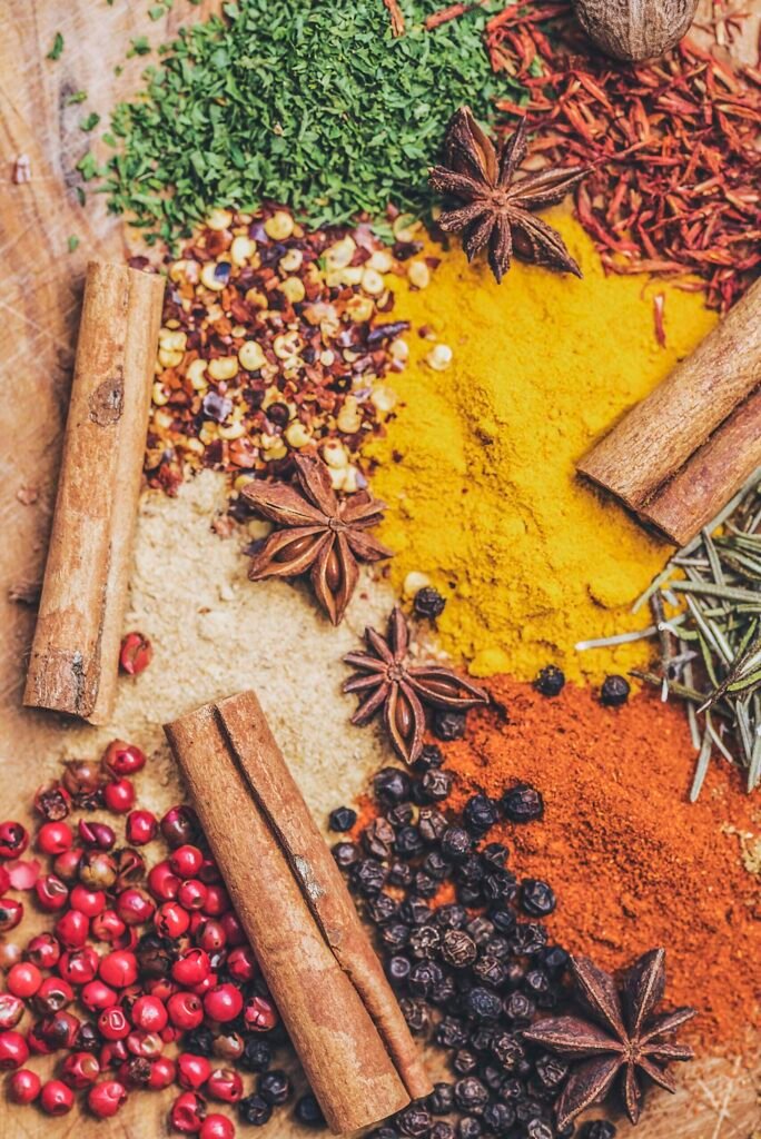 Dried seeds, bark and leaves arranged on a wooden board for a herbal prescription