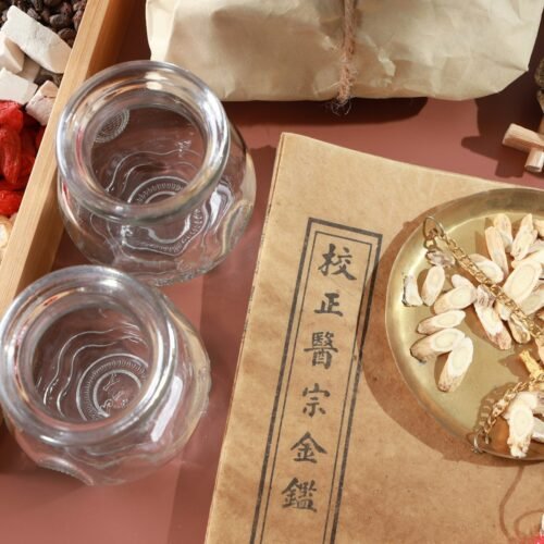 A small glass bottle of a medicated preparation on a wooden table